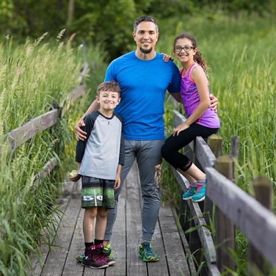 Healthy dad with son and daughter outdoors