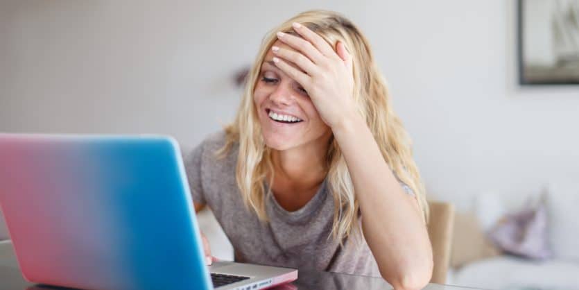 Blonde woman with laptop forget something buy in online store, facepalm
