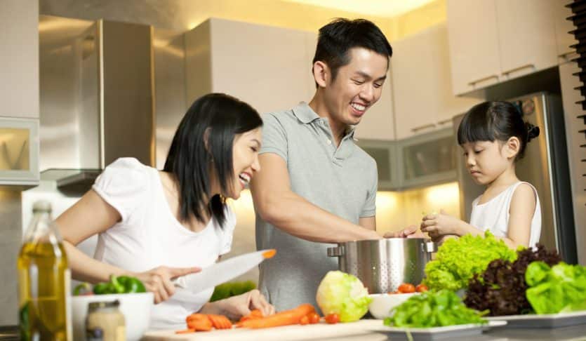 Asian Family spending time together in the kitchen