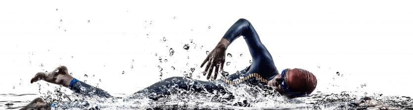 man triathlon iron man athlete swimmers swimming in silhouettes on white background