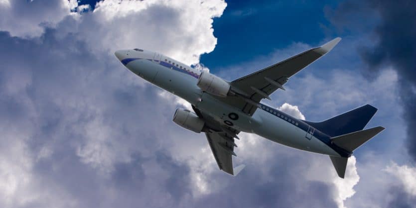 Plane taking off through thick clouds.