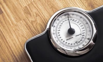 weight scale on wooden floor